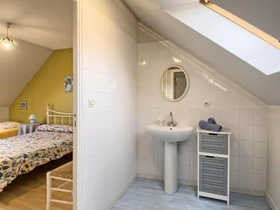 Un ou plusieurs lits dans un hébergement de l'établissement Apartment Au Coeur de la Baie by Interhome
