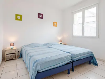 Un ou plusieurs lits dans un hébergement de l'établissement Holiday Home Néroli by Interhome
