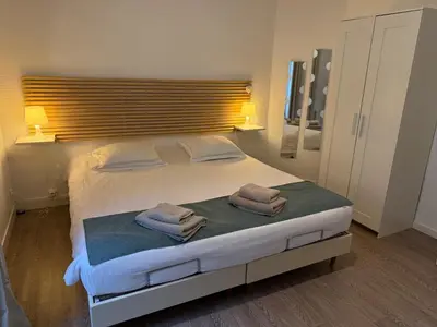 Un ou plusieurs lits dans un hébergement de l'établissement Fenêtres sur Mer Arromanches