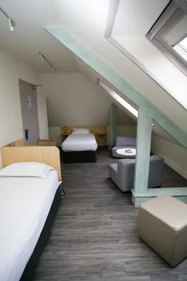 Un ou plusieurs lits dans un hébergement de l'établissement Hôtel Vert