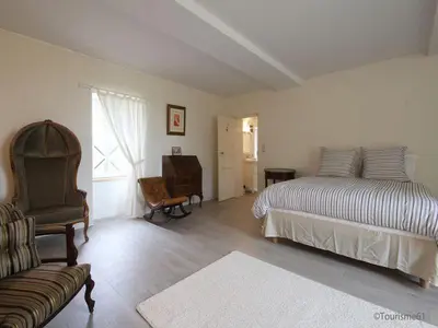 Un ou plusieurs lits dans un hébergement de l'établissement Le Manoir du Ribardon