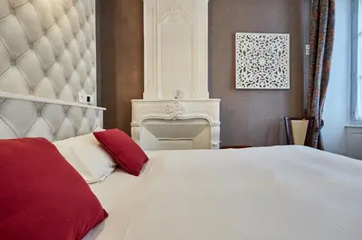 Un ou plusieurs lits dans un hébergement de l'établissement Hotel Saint Etienne