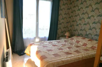 Un ou plusieurs lits dans un hébergement de l'établissement La maison dans le pré