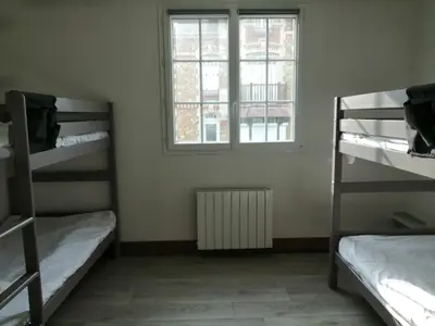Un ou plusieurs lits dans un hébergement de l'établissement Hotel de Normandie