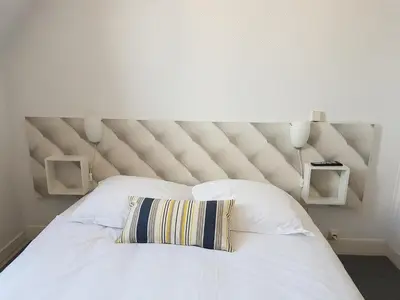 Un ou plusieurs lits dans un hébergement de l'établissement Hotel de Normandie