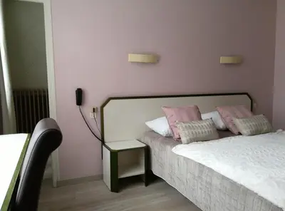 Un ou plusieurs lits dans un hébergement de l'établissement Hotel Napoléon
