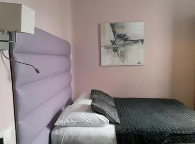 Un ou plusieurs lits dans un hébergement de l'établissement Hotel Napoléon