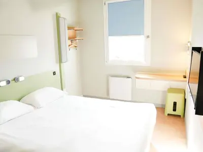 Un ou plusieurs lits dans un hébergement de l'établissement ibis budget Caen Porte de Bretagne