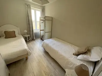 Un ou plusieurs lits dans un hébergement de l'établissement Arromanches D-Day Cottage