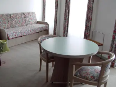 Coin salon dans l'établissement Le Grand Hotel