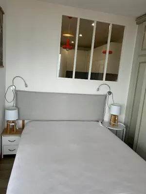 Un ou plusieurs lits dans un hébergement de l'établissement Cabourg Face A La Mer
