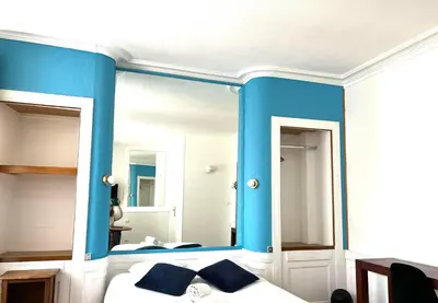 Un ou plusieurs lits dans un hébergement de l'établissement Hôtel Les Quais