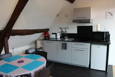 Cuisine ou kitchenette dans l'établissement Au cœur du centre historique