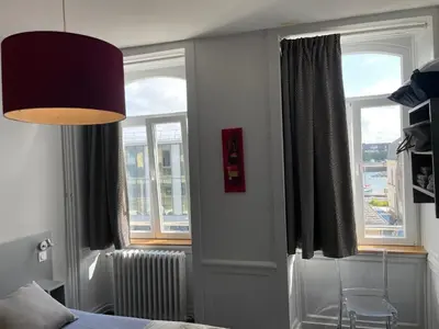Un ou plusieurs lits dans un hébergement de l'établissement Smartappart Cherbourg (la rose des vents)