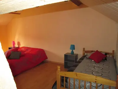 Un ou plusieurs lits dans un hébergement de l'établissement La Ferme de la Petite Noé