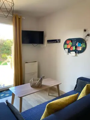 Télévision ou salle de divertissement dans l'établissement L'Escale Normande