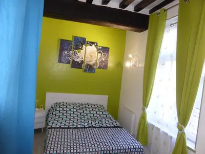 Un ou plusieurs lits dans un hébergement de l'établissement Appartement Bayeux
