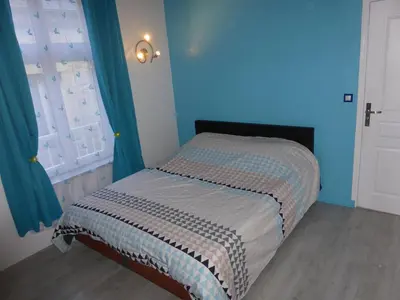 Un ou plusieurs lits dans un hébergement de l'établissement Appartement Bayeux