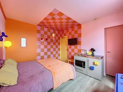 Un ou plusieurs lits dans un hébergement de l'établissement Appart Hôtel de la baie