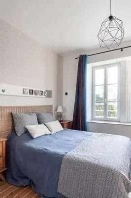 Un ou plusieurs lits dans un hébergement de l'établissement Le Cottage De La Baie