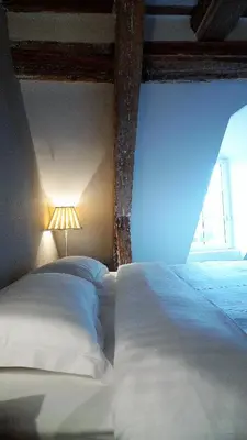 Un ou plusieurs lits dans un hébergement de l'établissement Les chambres de l'Abbaye