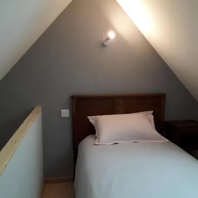 Un ou plusieurs lits dans un hébergement de l'établissement Relais de la Liberte - Utah Beach
