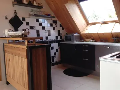 Cuisine ou kitchenette dans l'établissement Chez MARLENE