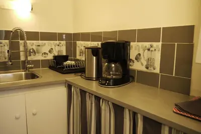 Cuisine ou kitchenette dans l'établissement Petite maison Normande