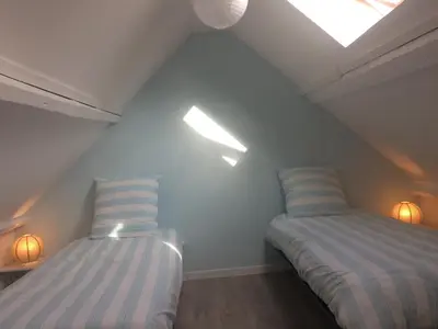 Un ou plusieurs lits dans un hébergement de l'établissement 50 m2 de charme au coeur des plaisirs de la côte
