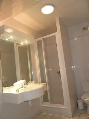 Salle de bains dans l'établissement Hotel Beau Rivage