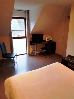 Un ou plusieurs lits dans un hébergement de l'établissement Auberge de la Baie
