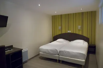 Un ou plusieurs lits dans un hébergement de l'établissement Auberge de la Baie
