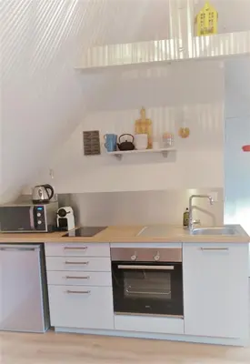 Cuisine ou kitchenette dans l'établissement Les Madeleines