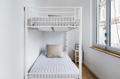 Un ou plusieurs lits dans un hébergement de l'établissement Appartement Bien-être 2 chambres au coeur de Cabourg -