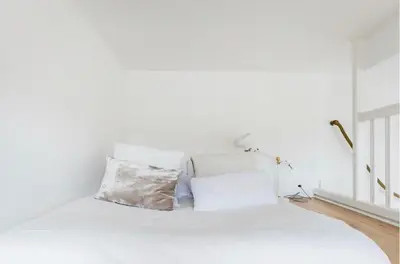Un ou plusieurs lits dans un hébergement de l'établissement Appartement Bien-être 2 chambres au coeur de Cabourg -