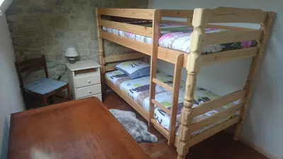 Un ou plusieurs lits dans un hébergement de l'établissement Gîte chez Lili