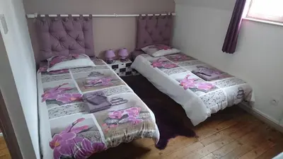 Un ou plusieurs lits dans un hébergement de l'établissement Gîte chez Lili