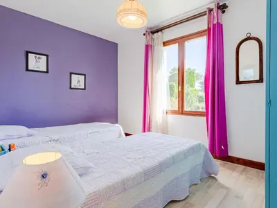 Un ou plusieurs lits dans un hébergement de l'établissement Holiday Home Colibri by Interhome