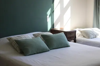 Un ou plusieurs lits dans un hébergement de l'établissement Chambres d'Hôtes Château de Martragny