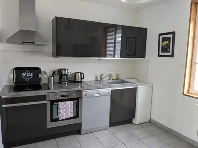Cuisine ou kitchenette dans l'établissement Maison de vacances cosy