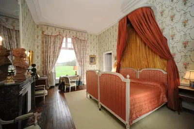 Un ou plusieurs lits dans un hébergement de l'établissement Chateau de Canisy