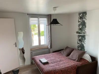 Un ou plusieurs lits dans un hébergement de l'établissement Beau duplex et studio proche de la mer