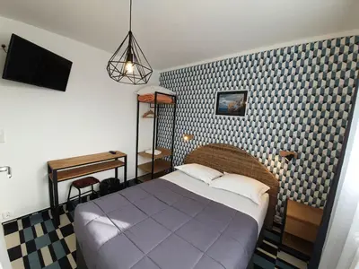 Un ou plusieurs lits dans un hébergement de l'établissement Hôtel Les Pieux En Cotentin