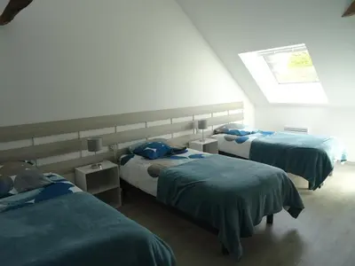 Un ou plusieurs lits dans un hébergement de l'établissement LA COURTEILLE