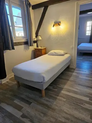 Un ou plusieurs lits dans un hébergement de l'établissement Hôtel François d'O
