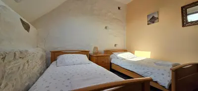 Un ou plusieurs lits dans un hébergement de l'établissement Gites Ferme de la Baie