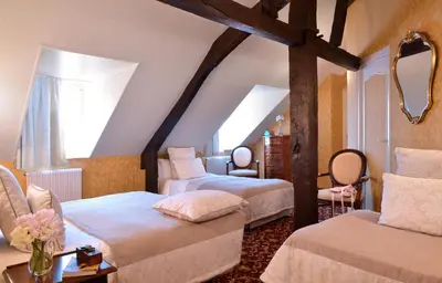 Un ou plusieurs lits dans un hébergement de l'établissement Hôtel d'Argouges