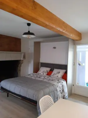Un ou plusieurs lits dans un hébergement de l'établissement Chambres d'hôtes les Clématites en Cotentin