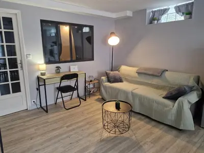 Coin salon dans l'établissement Appartement RDC Centre Cabourg