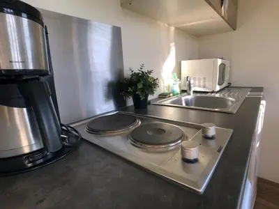 Cuisine ou kitchenette dans l'établissement la ferme des epis